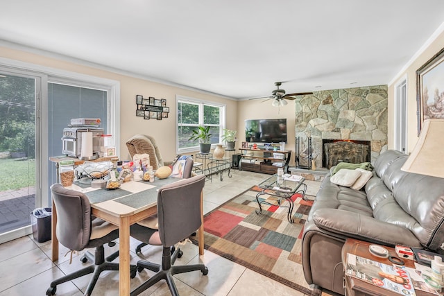 59 Laurel Wood Dr, Shelton, CT 06484 - living room with light tile patterned flooring, a ceiling fan, and a fireplace