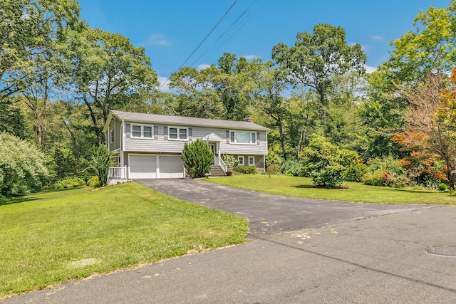59 Laurel Wood Dr, Shelton, CT 06484 - bi-level home featuring a chimney, asphalt driveway, a garage, and a front lawn