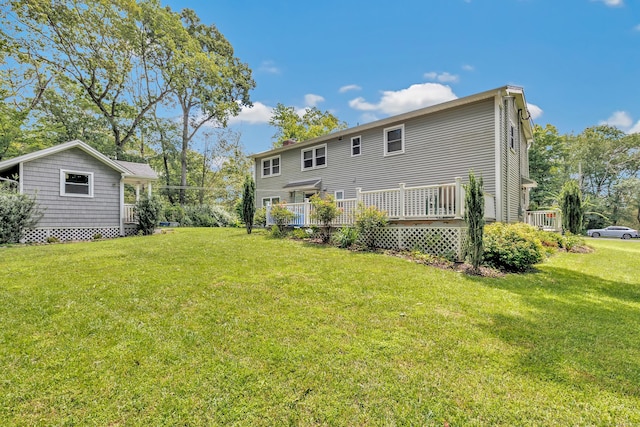 59 Laurel Wood Dr, Shelton, CT 06484 - back of property featuring a yard and a deck