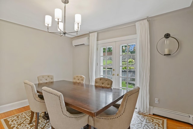 8 Gillies Ln, Norwalk, CT 06854 - dining space with a wall mounted air conditioner, baseboard heating, a chandelier, french doors, and light wood-type flooring