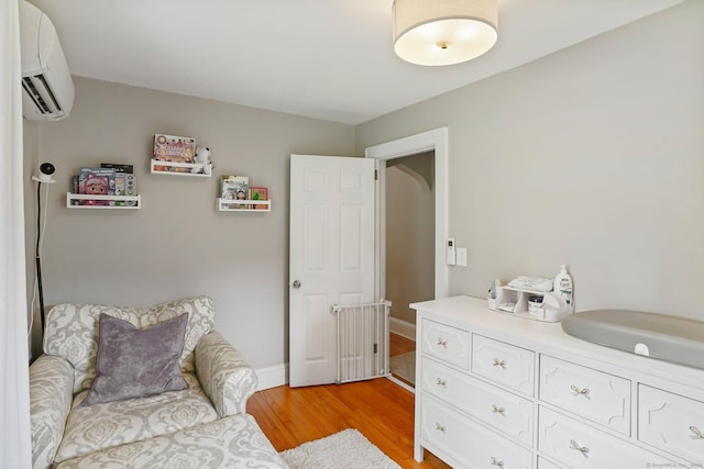 8 Gillies Ln, Norwalk, CT 06854 - sitting room with a wall mounted AC and light wood-type flooring