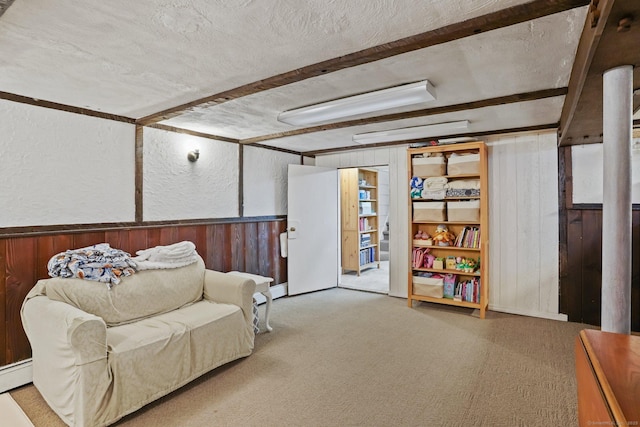 8 Gillies Ln, Norwalk, CT 06854 - living area featuring wood walls, beam ceiling, carpet floors, and a textured ceiling