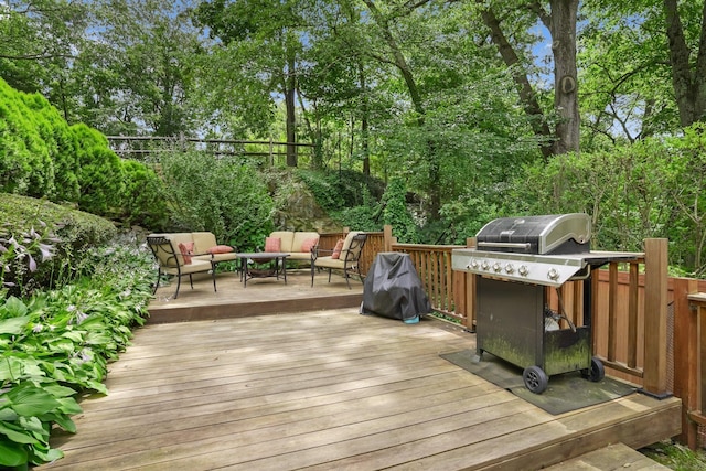 8 Gillies Ln, Norwalk, CT 06854 - deck with outdoor lounge area, area for grilling, and view of wooded area