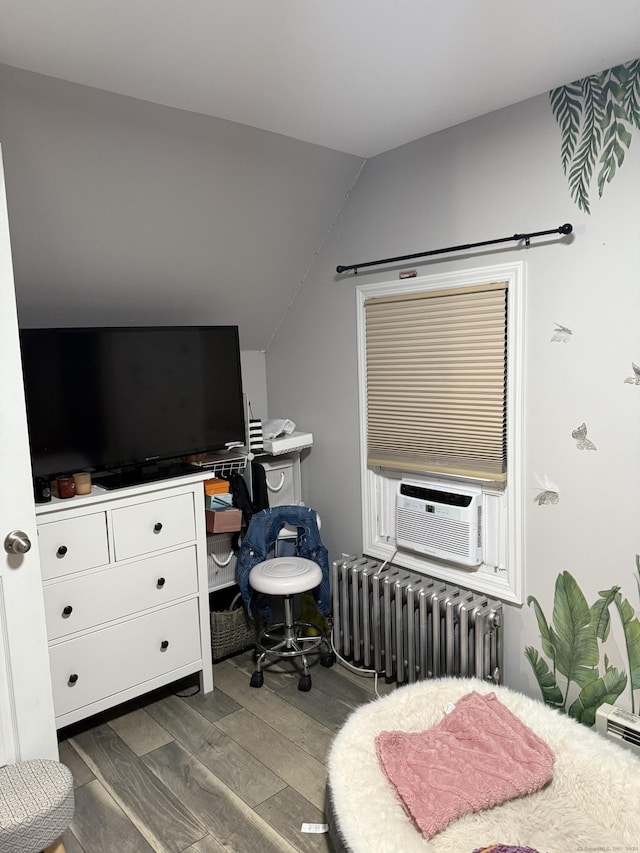 32 S St, Norwalk, CT 06854 - bedroom featuring radiator, lofted ceiling, dark wood-style floors, and cooling unit