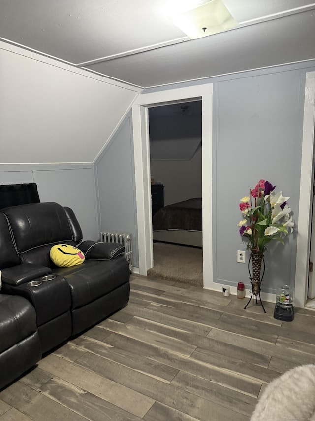 32 S St, Norwalk, CT 06854 - living area featuring wood finished floors, radiator, and lofted ceiling
