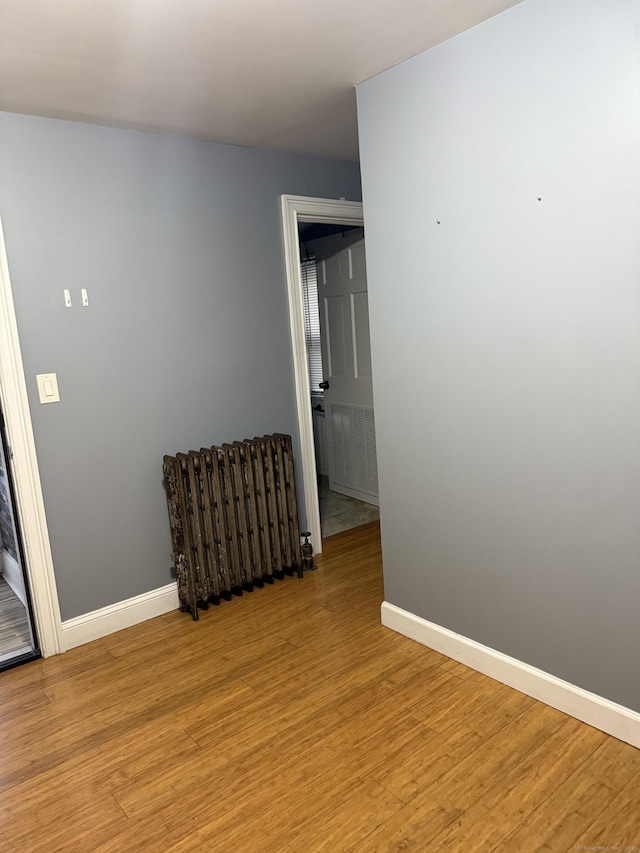 32 S St, Norwalk, CT 06854 - spare room featuring light wood finished floors and radiator