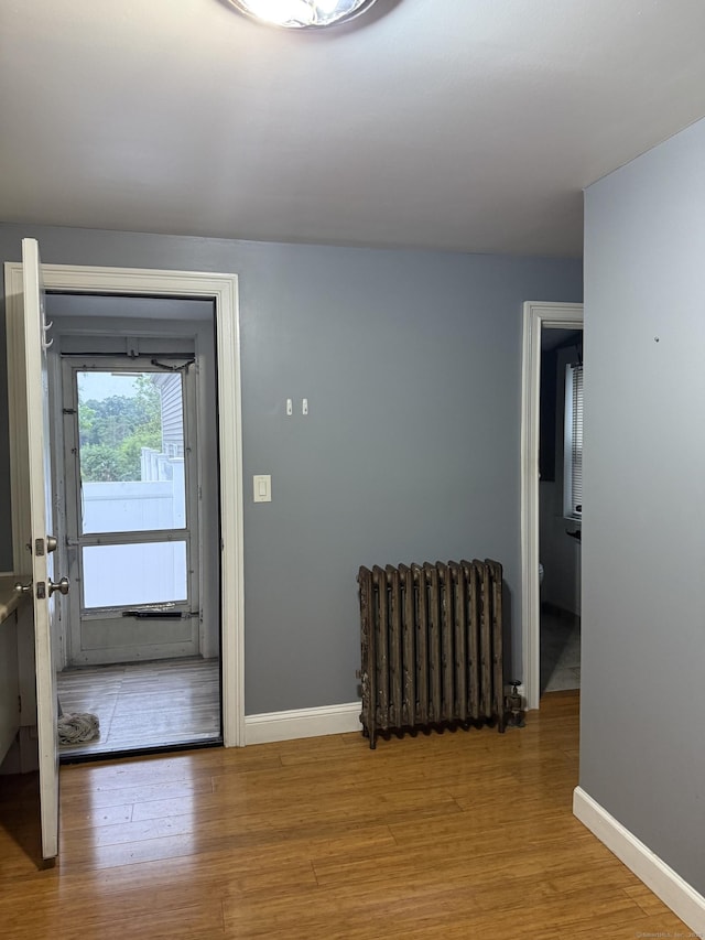32 S St, Norwalk, CT 06854 - foyer entrance with radiator heating unit and wood finished floors