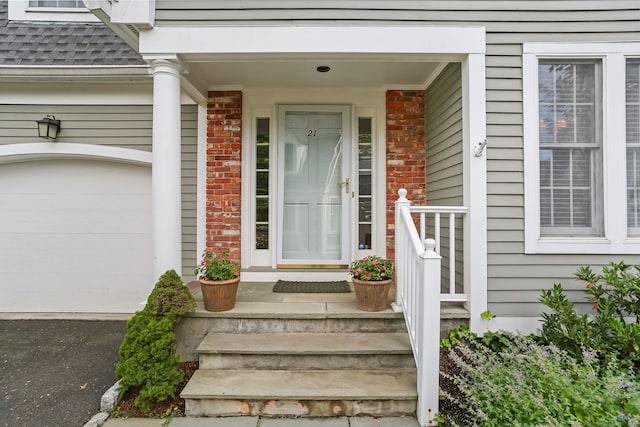21 Lakeview Ave Unit 21, New Canaan, CT 06840 - doorway to property with brick siding, roof with shingles, and a porch
