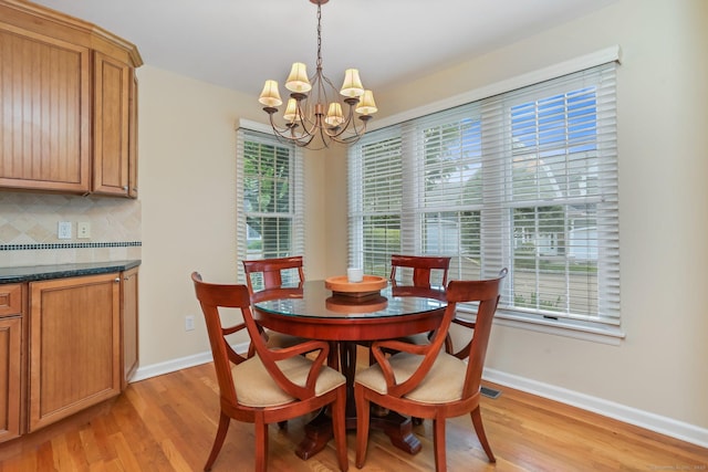 21 Lakeview Ave Unit 21, New Canaan, CT 06840 - dining area featuring a chandelier, light wood-type flooring, and healthy amount of natural light