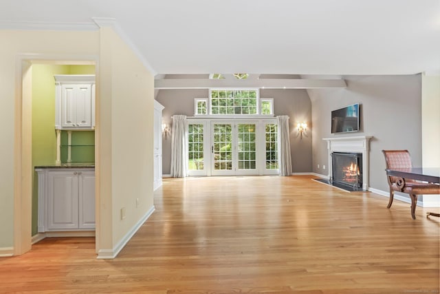 21 Lakeview Ave Unit 21, New Canaan, CT 06840 - unfurnished living room featuring light wood finished floors and a warm lit fireplace