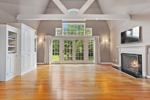 21 Lakeview Ave Unit 21, New Canaan, CT 06840 - unfurnished living room with a fireplace with flush hearth, light wood-style floors, high vaulted ceiling, and beam ceiling