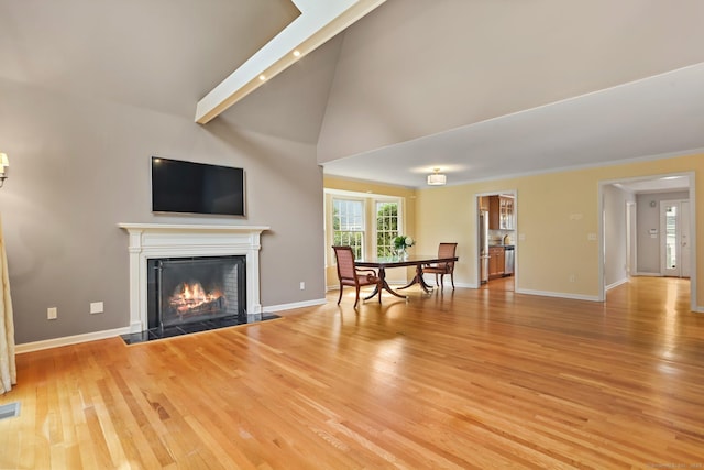21 Lakeview Ave Unit 21, New Canaan, CT 06840 - living room with light wood-style floors, a fireplace with flush hearth, and vaulted ceiling
