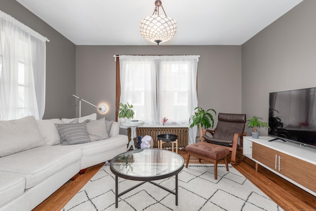 27 Thornton St, Hamden, CT 06517 - living area featuring plenty of natural light and light wood-style floors