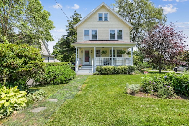24 Warren Ave, Groton, CT 06355 - american foursquare style home with a porch and a front lawn