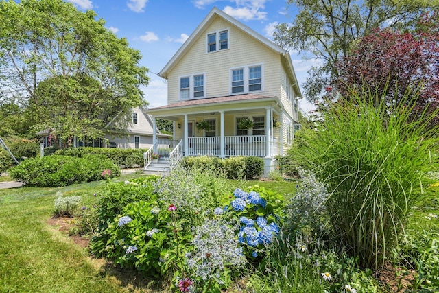 24 Warren Ave, Groton, CT 06355 - view of front facade with a porch and a front yard