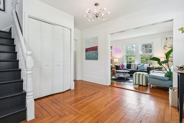 24 Warren Ave, Groton, CT 06355 - entrance foyer featuring stairway, a chandelier, and wood-type flooring