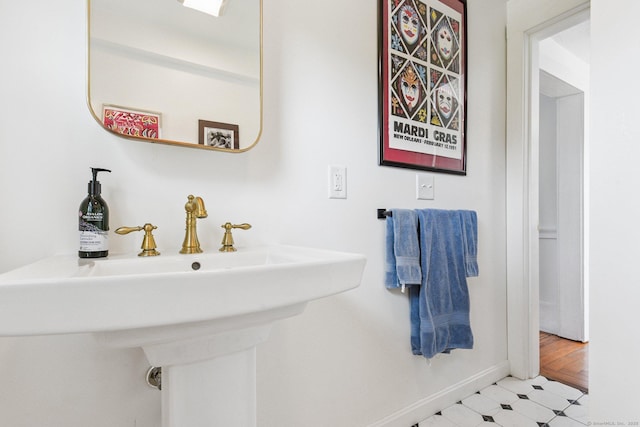 24 Warren Ave, Groton, CT 06355 - bathroom with a sink and baseboards