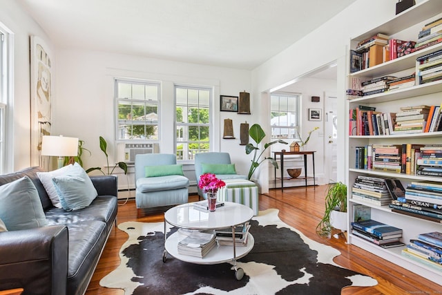24 Warren Ave, Groton, CT 06355 - living area featuring a baseboard heating unit, wood finished floors, and cooling unit