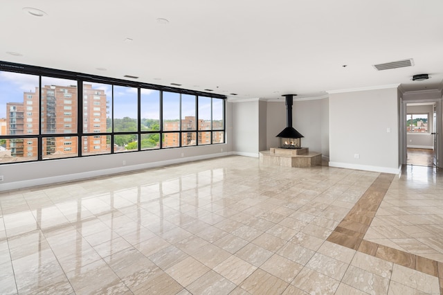 104 N St Apt 803, Stamford, CT 06902 - unfurnished living room with crown molding, a wood stove, and inlaid floor details