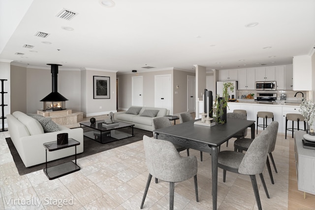 104 N St Apt 803, Stamford, CT 06902 - dining area with ornamental molding and recessed lighting