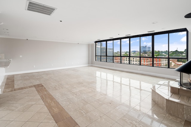104 N St Apt 803, Stamford, CT 06902 - spare room with ornamental molding and light tile patterned floors