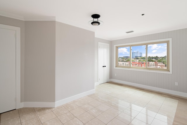 104 N St Apt 803, Stamford, CT 06902 - spare room with light tile patterned flooring and crown molding