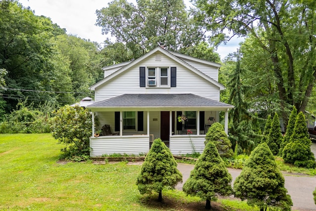 610 S Elm St, Wallingford, CT 06492 - view of front facade with a front lawn, roof with shingles, and covered porch