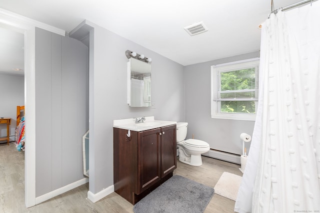 610 S Elm St, Wallingford, CT 06492 - full bathroom with a baseboard radiator, wood finished floors, vanity, and a shower with curtain