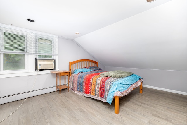 610 S Elm St, Wallingford, CT 06492 - bedroom with cooling unit, wood finished floors, vaulted ceiling, a baseboard heating unit, and recessed lighting
