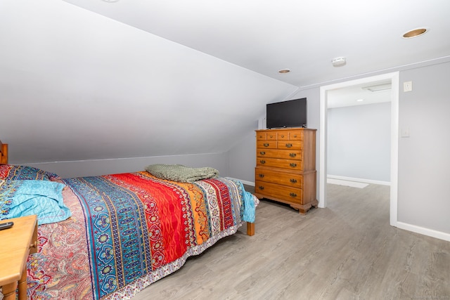 610 S Elm St, Wallingford, CT 06492 - bedroom featuring light wood-type flooring and vaulted ceiling