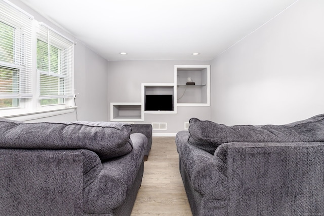 610 S Elm St, Wallingford, CT 06492 - living room featuring light wood-style floors and built in shelves