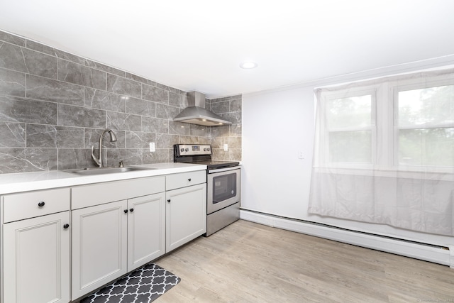 610 S Elm St, Wallingford, CT 06492 - kitchen with wall chimney range hood, electric stove, a baseboard radiator, backsplash, and light countertops