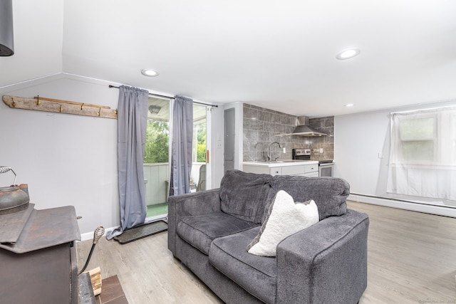 610 S Elm St, Wallingford, CT 06492 - living area featuring light wood-style floors, a baseboard radiator, and recessed lighting