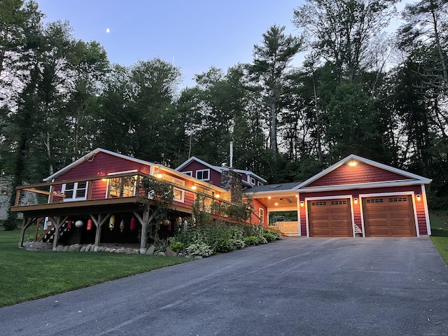 23 Little Bunggee Hill Rd, Woodstock, CT 06282 - view of front of home featuring a front yard, a garage, a wooden deck, and driveway