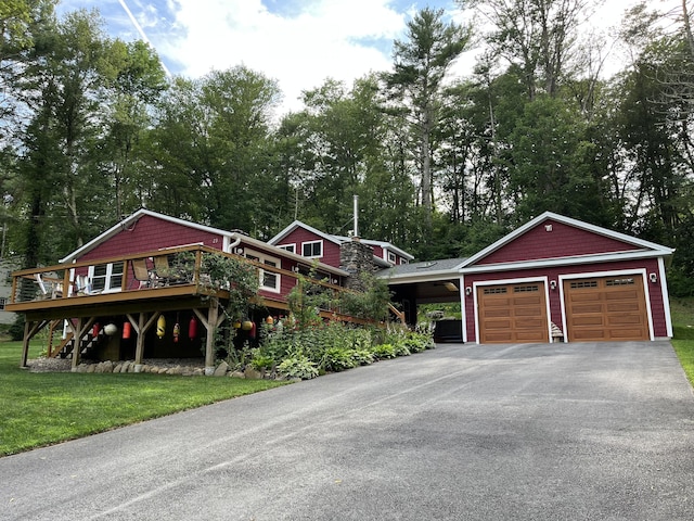 23 Little Bunggee Hill Rd, Woodstock, CT 06282 - view of front of property featuring driveway, a deck, a front lawn, a garage, and view of scattered trees