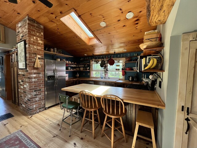 23 Little Bunggee Hill Rd, Woodstock, CT 06282 - kitchen featuring stainless steel appliances, open shelves, a skylight, light wood finished floors, and wood ceiling
