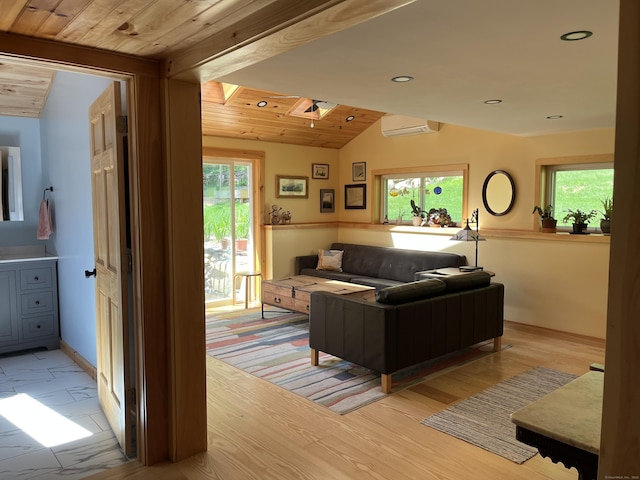 23 Little Bunggee Hill Rd, Woodstock, CT 06282 - living area with lofted ceiling, plenty of natural light, a wall unit AC, a skylight, and light wood-type flooring