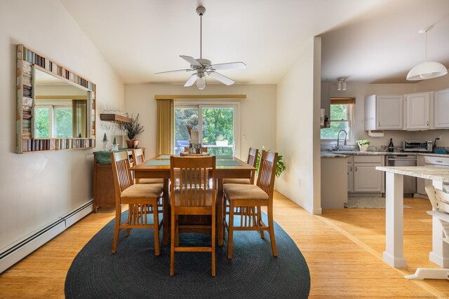 111 Nicole Dr, Milford, CT 06460 - dining area featuring baseboard heating, plenty of natural light, light wood-type flooring, and a ceiling fan