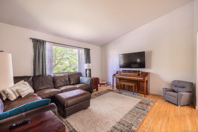 111 Nicole Dr, Milford, CT 06460 - living area with lofted ceiling and wood finished floors