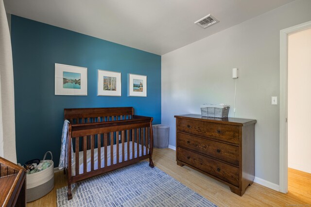 111 Nicole Dr, Milford, CT 06460 - bedroom with wood finished floors and a nursery area
