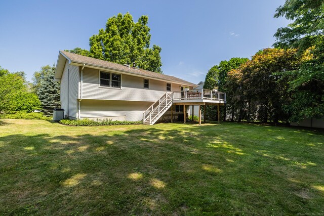 111 Nicole Dr, Milford, CT 06460 - rear view of property with stairs, a wooden deck, and a lawn