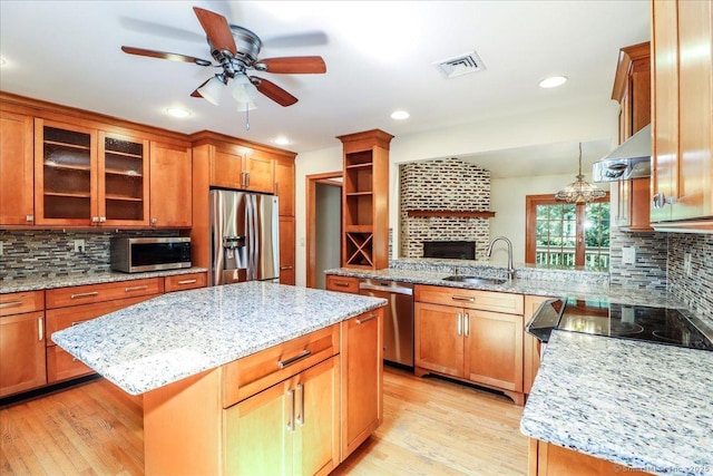 6 Big Buck Ln, Brookfield, CT 06804 - kitchen with stainless steel appliances, a ceiling fan, ventilation hood, tasteful backsplash, and light wood-style floors