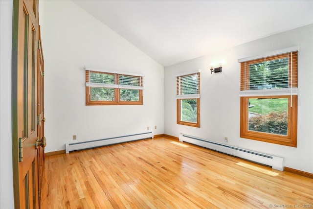 6 Big Buck Ln, Brookfield, CT 06804 - empty room featuring a baseboard heating unit, light wood finished floors, and vaulted ceiling