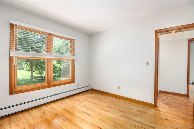 6 Big Buck Ln, Brookfield, CT 06804 - empty room with a baseboard radiator and light wood-style floors