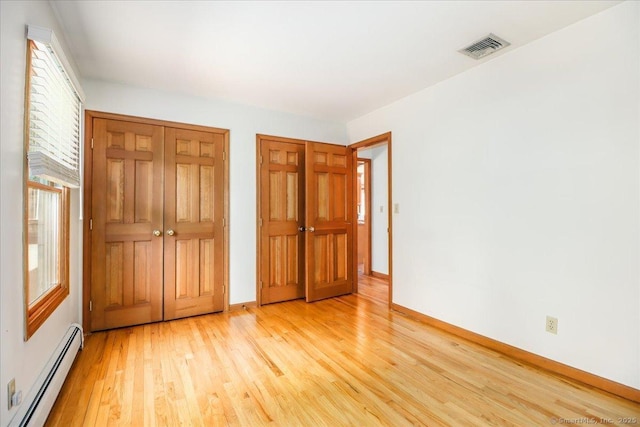 6 Big Buck Ln, Brookfield, CT 06804 - unfurnished bedroom featuring a baseboard radiator and light wood-type flooring