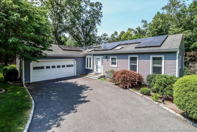 6 Big Buck Ln, Brookfield, CT 06804 - view of front of house with roof with shingles, driveway, solar panels, and an attached garage