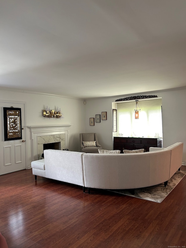 210 Jamestown Rd Unit 210, Stratford, CT 06614 - living area featuring a fireplace, wood finished floors, and crown molding