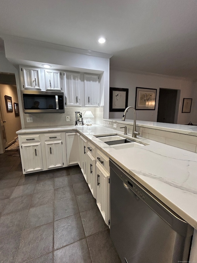 210 Jamestown Rd Unit 210, Stratford, CT 06614 - kitchen with stainless steel appliances, white cabinetry, crown molding, recessed lighting, and a peninsula