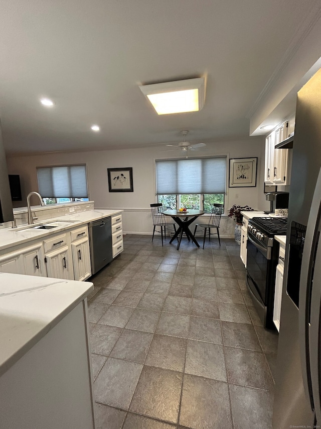 210 Jamestown Rd Unit 210, Stratford, CT 06614 - kitchen featuring appliances with stainless steel finishes, white cabinets, light countertops, a ceiling fan, and recessed lighting