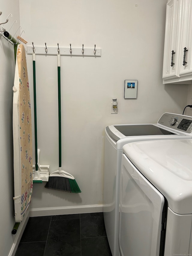 210 Jamestown Rd Unit 210, Stratford, CT 06614 - laundry room with independent washer and dryer, cabinet space, and dark tile patterned floors